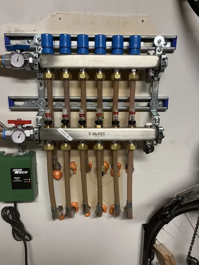 Plumber performing Water Heater Repair at a residential property in Kinderhook